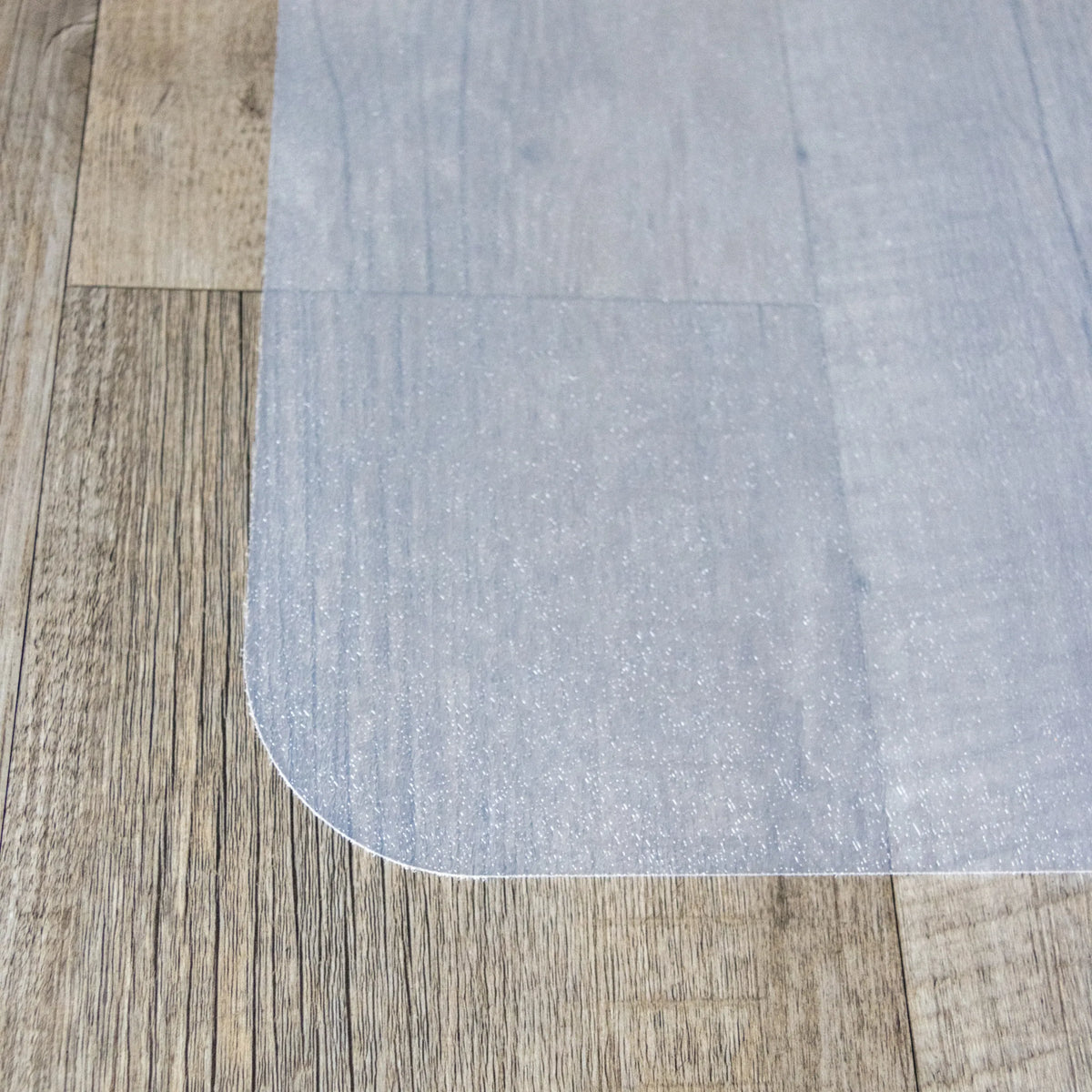 Afgeronde hoek van de melkwitte Vloermat FORTIFLEX voor harde vloeren van hjh OFFICE