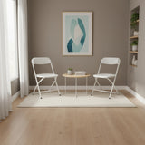Twee witte TUDELA XXL PRO W outdoor stoelen met een ronde bijzettafel in een modern ingerichte ruimte van hjh OFFICE