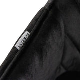 Logo-etiket op de zwarte stofbekleding van de Eetkamerstoel CHARVELLE van hjh LIVING