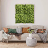 Groene plantmat LEAFLUXE 3 als vierkant wandbeeld boven een bank van hjh LIVING