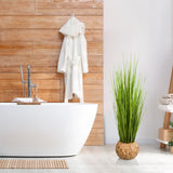 Groene kunstplant CORTADERIA in een gevlochten mand als decoratie van hjh OFFICE