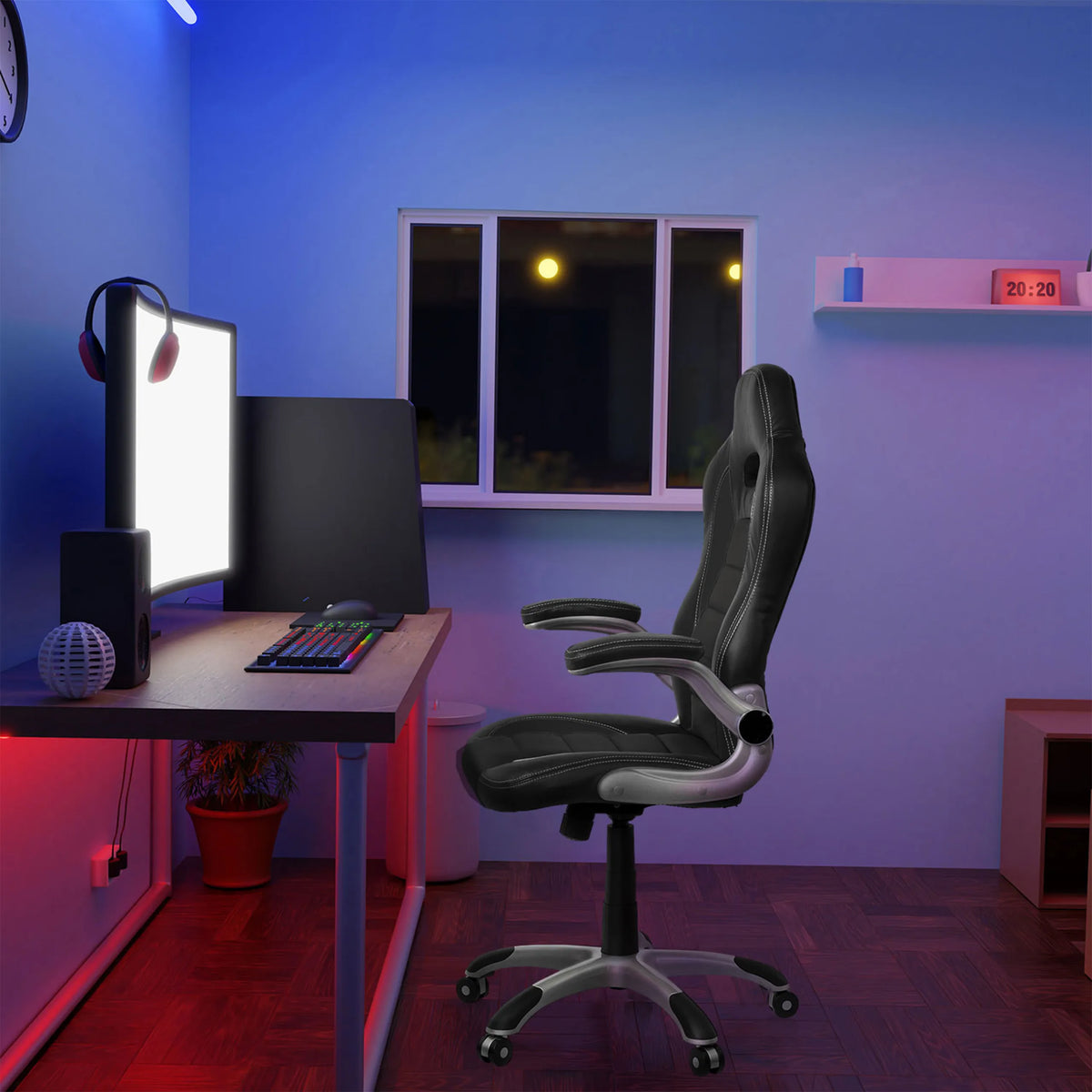 Zwarte GAME SPORT gamestoel met armleuningen aan een bureau in een verlichte kamer van hjh OFFICE