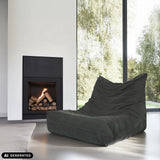 Grijze loungestoel Sitzolo van corduroy voor een open haard van hjh LIVING (AI-gegenereerde afbeelding)