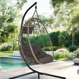 Hangstoel COCOVA in zwart en grijs met een mandframe en kussens van hjh LIVING
