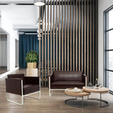Bruine gestoffeerde fauteuil ARUBA met wit metalen frame in een moderne kantooromgeving van hjh OFFICE