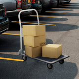 Blauw-witte platformwagen CARRY met drie geladen kartonnen dozen op een parkeerplaats van hjh OFFICE
