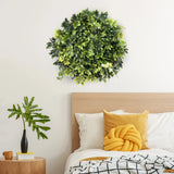 Groene plantmat LEAFLUXE WALL 2 als ronde wanddecoratie boven een bed van hjh LIVING
