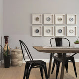 Zwarte metalen Bistrostoelen VANTAGGIO COMFORT aan een houten tafel van hjh OFFICE