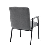Achterzijde van de grijze gestoffeerde fauteuil Lifea Flex met zwarte metalen poten en armleuningen van hjh LIVING