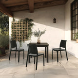 Drie zwarte Outdoor stoelen T37 V met bijpassende tafel op een terras van hjh LIVING