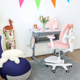 Roze kinderstoel KID WING met wit frame en wieltjes voor een kinderbureau van hjh OFFICE