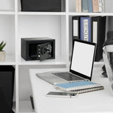 Zwarte kluis SAFE COMPACT III met openstaande deur en draaislot in een wit rek van hjh OFFICE