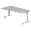 Grijs bureau BELA 18 S met een gebogen blad en twee metalen poten van hjh OFFICE PRO