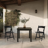 Twee zwarte TRAVANO 1 outdoor stoelen met bijpassende tafel op een terras van hjh LIVING