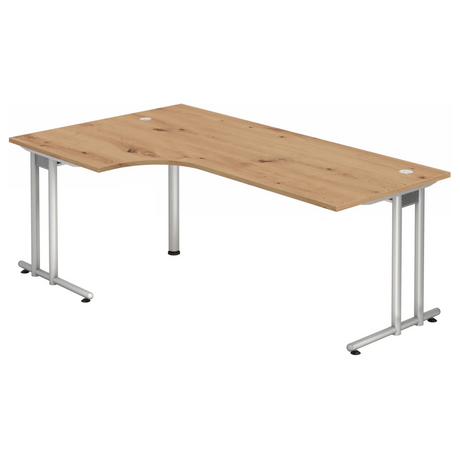 L-vormig bureau NANO 82 S in essen eiken met zilveren frame en twee kabeluitlaten van hjh OFFICE PRO